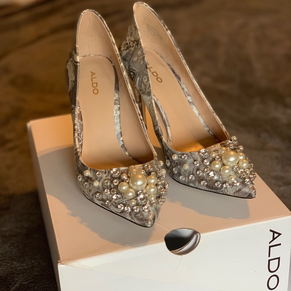 Heels with pearl and rhinestone accents.